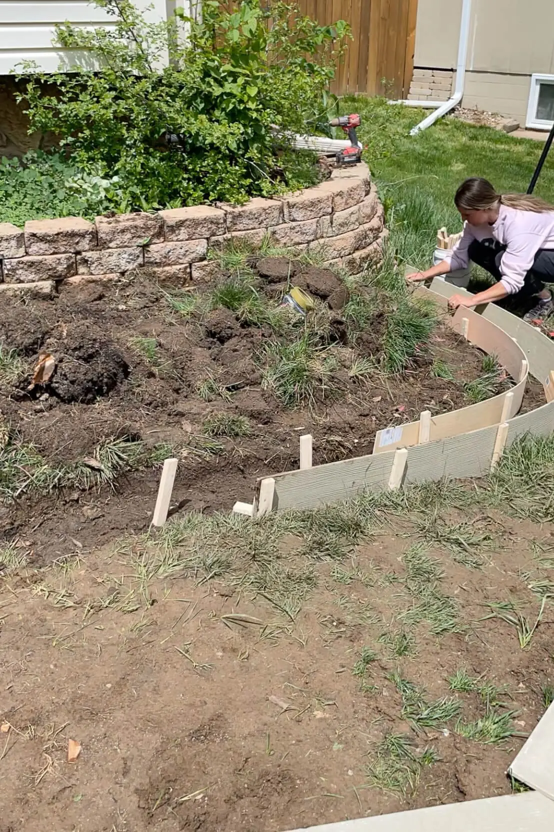 Setting forms for pouring concrete for DIY concrete curbing.
